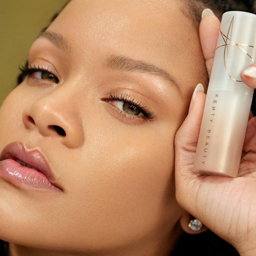 Rihanna, Founder of inclusive beauty brand, Fenty Beauty, holding the Fenty Beauty Eaze Drop Tint Stick Rihanna, Founder of inclusive beauty brand, Fenty Beauty, holding the Fenty Beauty Eaze Drop Tint Stick